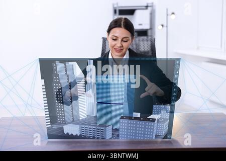 Building information modelling. Woman using virtual screen in office Stock Photo