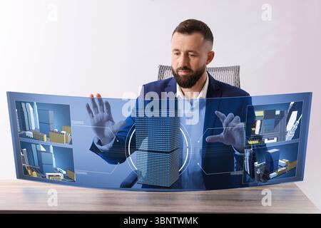 Building information modelling. Man using virtual screen in office Stock Photo