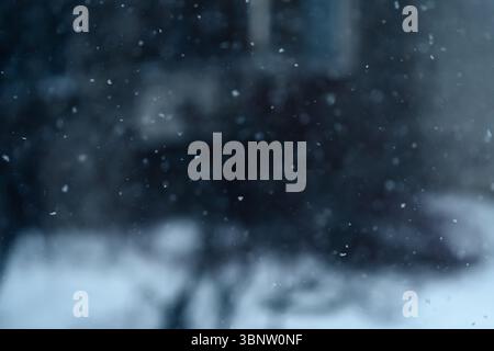 Winter. Falling snow with snowflakes in the background. Stock Photo