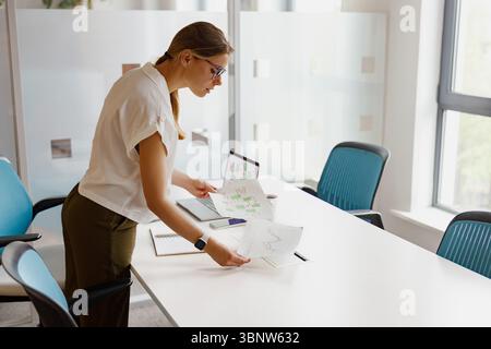 Office organization and administration, businesswoman arranging folders ...