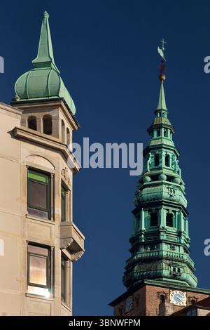 Bell tower of Nikolaj Kunsthal, contemporary arts center which occupies the former St. Nicholas Church, Copenhagen Stock Photo