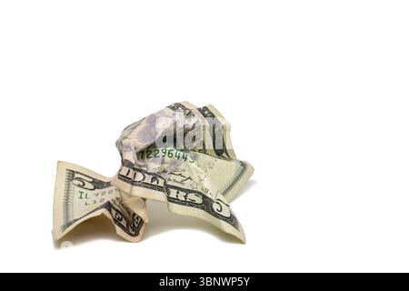 A crumpled up five dollar bill. Stock Photo