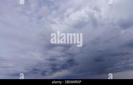 Grey rain clouds covering the sky, Finland Stock Photo