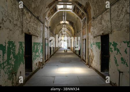 Abandoned prison corridor inside Eastern State Penitentiary, historic site in Philadelphia, USA Stock Photo