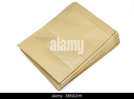 Stack of empty brown doypack bags isolated on white background Stock Photo