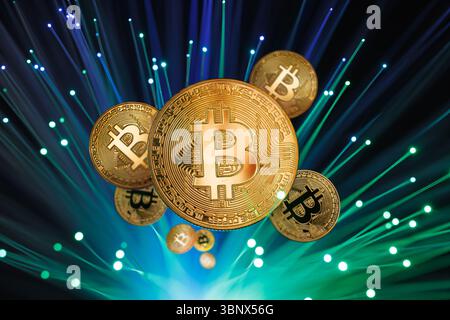 Bitcoin coins with glowing fiber optics, symbolizing digital currency, global cryptocurrency exchange, and online finance Stock Photo
