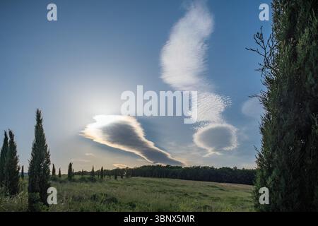 High clouds hiding the sun over Tuscany country, Italy Stock Photo