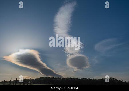 High clouds hiding the sun over Tuscany country, Italy Stock Photo