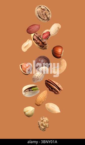 Peanut and other nuts falling on brown background Stock Photo