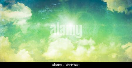Showing bright sun disk in flat design featuring green-blue gradient sky with clouds, brushstrokes Stock Photo