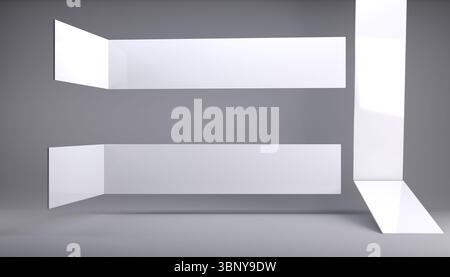 White geometric planes are floating in minimalist gray studio space, forming L shaped composition Stock Photo