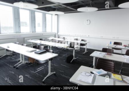 White tables and brown chairs are forming conference layout in flat design with notebooks and pens Stock Photo
