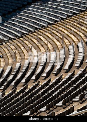 Curving rows of empty seats create abstract lines and patterns inside the historic 1992 Olympic Stadium in Barcelona, Spain. Stock Photo