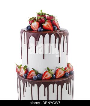 White cake with melted dark chocolate with fresh berries Stock Photo