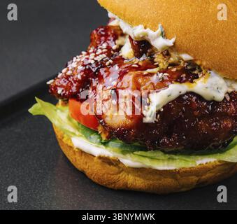food still-life, Craft burger is cooking on black tray Stock Photo