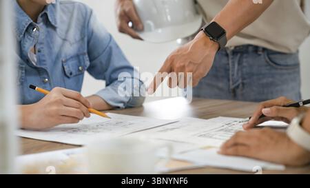 Man architect working On the desk construction project ideas architects engineer Concept Stock Photo