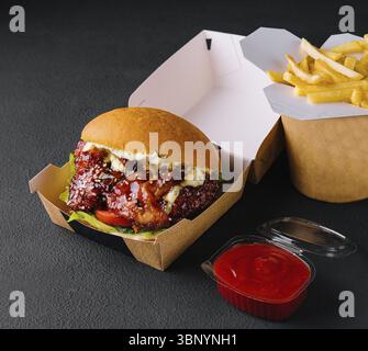 food still-life, Barbeque chicken meat burger and french fries Stock Photo