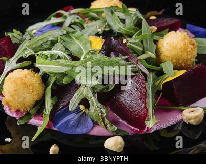 food still-life, Beetroot salad with arugula and cheese balls Stock Photo