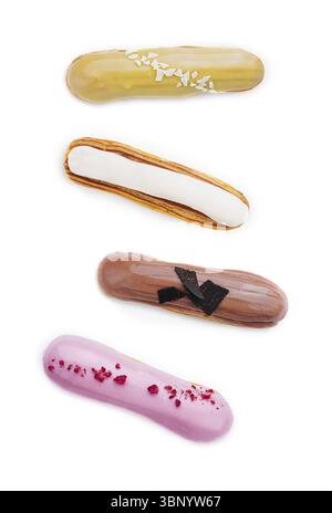 Different types of eclairs with different glazes isolated on white background Stock Photo