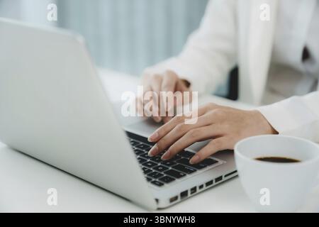 Confident young asian businesswoman working with tablet Start up small business owner. business successful technology concept Stock Photo