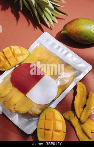 food still-life, Pack of dried mango slices and raw mango Stock Photo
