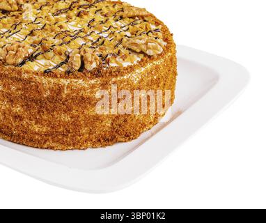 Cake with walnuts and honey on plate Stock Photo