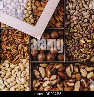 Assorted nuts in a wooden box Stock Photo