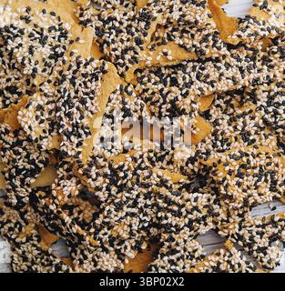 food still-life, Salted tortilla chips triangle with chia seeds on top view Stock Photo