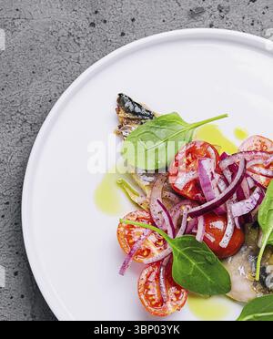 food still-life, Mackerel with cherry tomatoes and red onions Stock Photo