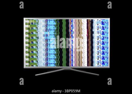 Grey 4K television with digital glitches, distortions on the screen isolated on a black background Stock Photo