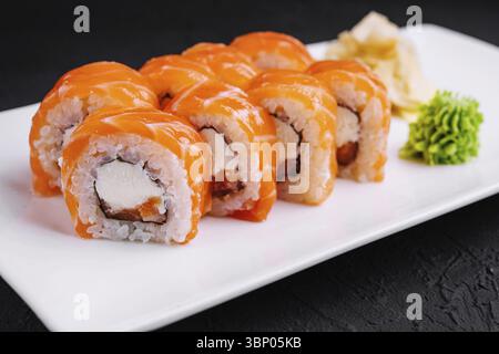 Sushi roll philadelphia with salmon and caviar on plate Stock Photo