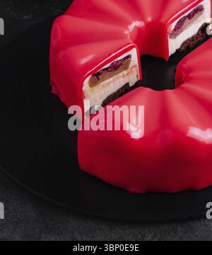 food still-life, Multi layered raspberry mousse cake on plate Stock Photo