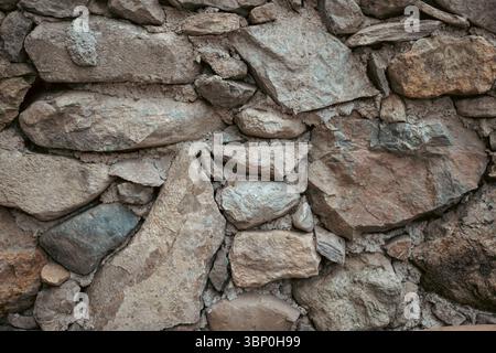 Ancient Cretan stone masonry with stones of different sizes Stock Photo