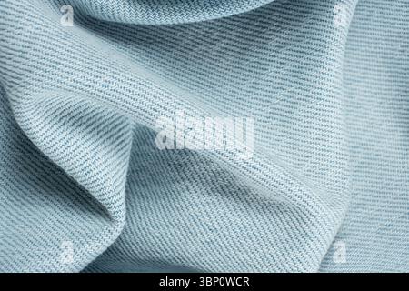 Wavy Pattern of Blue Jean Fabric. Close-Up Textured. Stock Photo