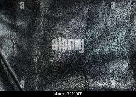 Minimalist Black Leather Texture Close-Up. Stock Photo