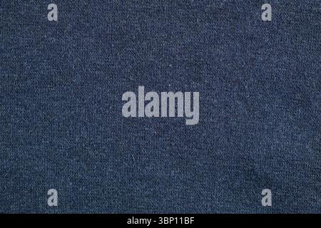 Old worn-out cotton and elastane fabric, fabric fibers and pilling. Stock Photo
