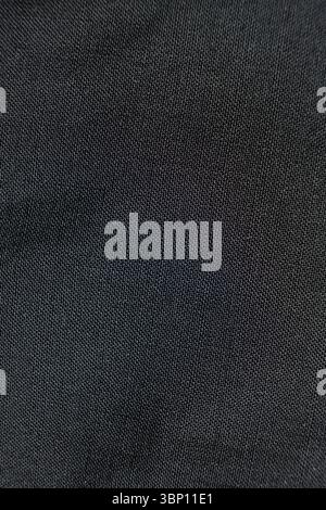 Fabric composed of wool and polyester, macro texture, abstract black fabric background Stock Photo
