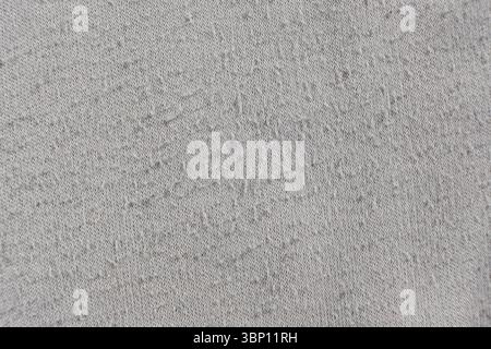 Close-Up of Old Cotton Fabric with Pilling Texture. Stock Photo