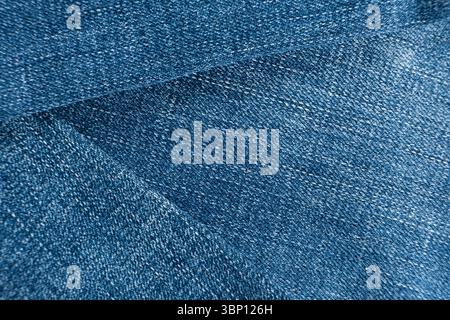 Macro texture of cotton blue denim fabric. Stock Photo