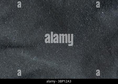 Close-Up of Old Cotton Polyester Elastane Fabric with Pilling Texture. Stock Photo