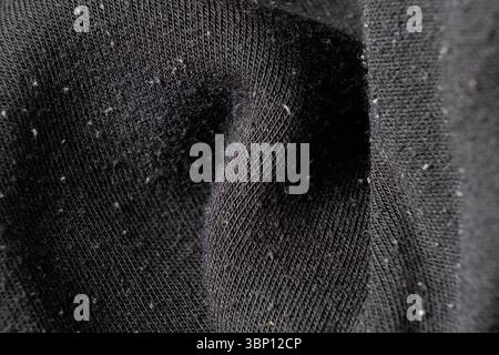 Close-Up of Old Cotton Polyester Elastane Fabric with Pilling Texture. Stock Photo