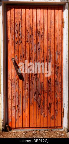 Paint peels off from an old wooden door, Finland Stock Photo