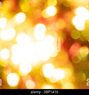 Golden Holiday Lights Blurred for Seasonal Sales. Stock Photo