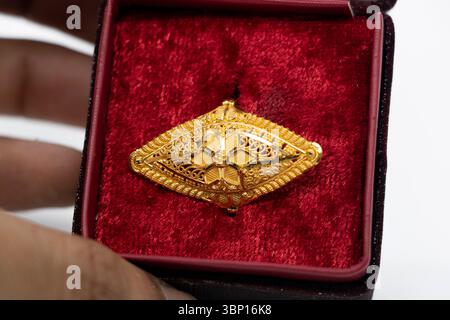 gold wedding ring with a box on a light background. Stock Photo