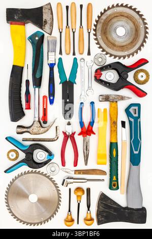 Flat lay of new and used hand tools on white background. Large collection of various tools and bits arranged on white. Stock Photo