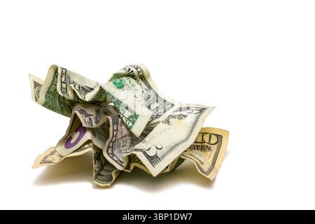 A pile of crumpled up dollars bills consisting of a one, five, and ten dollar bill. Stock Photo