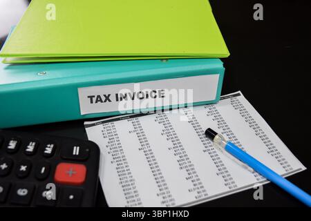 Folders with the label Tax invoice. Business management concept Stock Photo