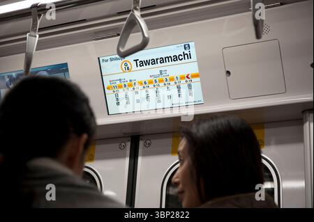 Display monitor aboard Tokyo's Ginza Line subway train announcing Tawaramachi as the next stop, the oldest subway line in Tokyo, Japan. Stock Photo