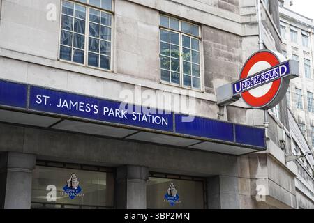 Entrance to St James's Park underground, tube station roundel sign London England United Kingdom UK Stock Photo