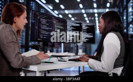 Innovative African Programmer Collaborating With Diverse Team On Software Development Stock Photo